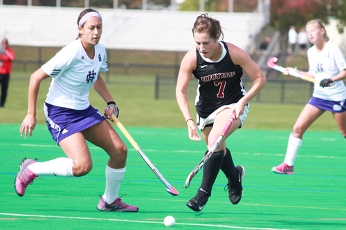Hanna Sotiropoulos ‘14  fights for possession of the ball against Holy Cross. 