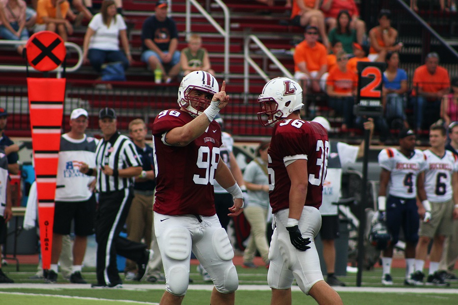 Alex White 14 (left) had four tackles and a sack as the Lafayette Leopards got their first win of the season in dominant fashion, dominating the woeful Bucknell Bison 31-7. (Photo by Austin Drucker 17)
