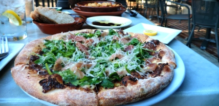 The Valenca Pizza, topped with jig jam, brie cheese, arugula, and honey