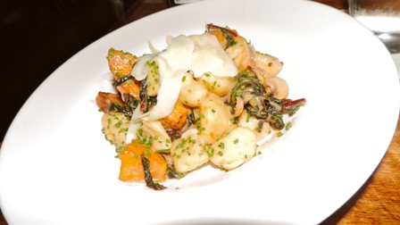 The Duck Confit Gnocchi, a rustic dish served with butternut squash and Swiss chard in a maple cider cream sauce. 