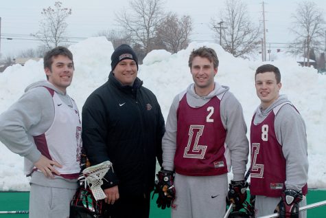 From left to right: midfielder and co-captain Jake Mann ‘14, head coach Jim Rogalski , defenseman and co-captain Matt Evans ‘14 and , midfielder and co-captain Brendan Gover ‘14. 