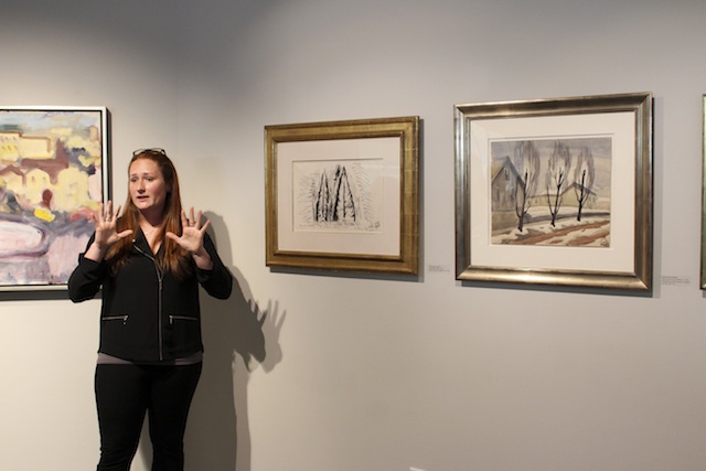 Andrea Cerbie ‘08 discusses the pieces in her curatorial exhibit, “Painterly
Perspectives.” [Photo by Julia Brennan ‘17]