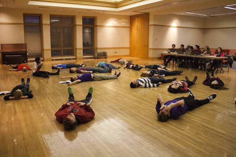 The cast of The Mystery of Edwin Drood performs warm-up exercises
during a rehearsal for the musical. [Photo by Elizabeth Lucy ‘15]