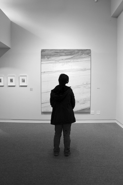 Julia Guarch ‘15 stares up at a painting by New York artist, Claire Sherman.
[Photo by Julia Brennan ‘17]