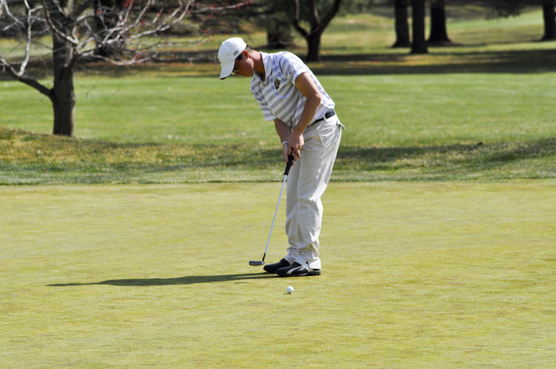 Senior Mike Zausmer rolls a put in the spring. [Photo Courtesy of Athletic Communications]