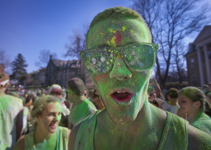 A student celebrates Holi outside Grossman House during last year’s event. [Photo courtesy of  Chuck Zovko, Communications Division ]