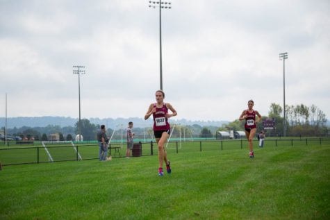 Emily Moore 19 running in the Leopard Invitational. (Courtesy of Athletic Communications)