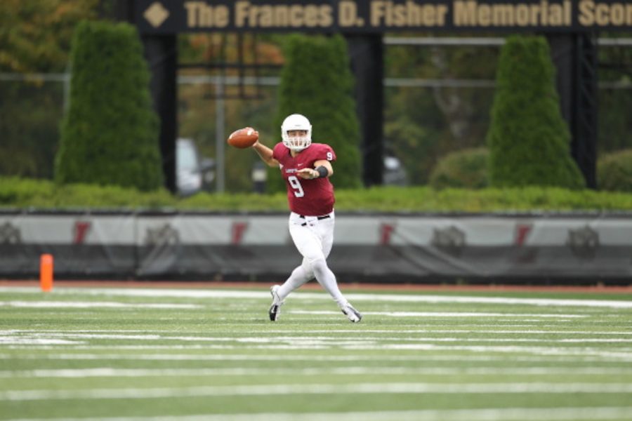 Blake Searfoss 17 preparing to throw downfield. (Courtesy of Athletic Communications)