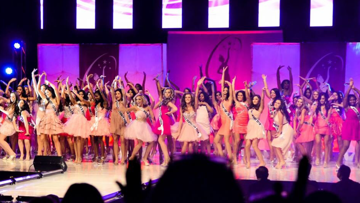 Gina Bianchi and other members of the Miss New York Teen 2014 competition wave to the audience. (Courtesy of Angelina Bianchi '18)