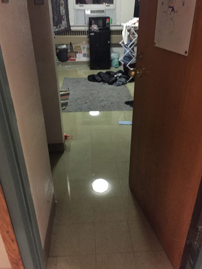 Picture of flooded room on the first floor of Ruef Hall. (Photo by Claire Grunewald 20)
