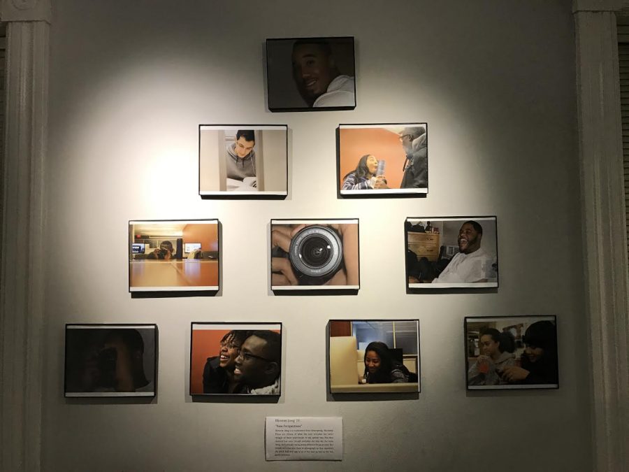 Members of NIA present artwork in an exhibit at the Portlock Black Cultural Center (Photo Courtesy of George Odigwe '20).