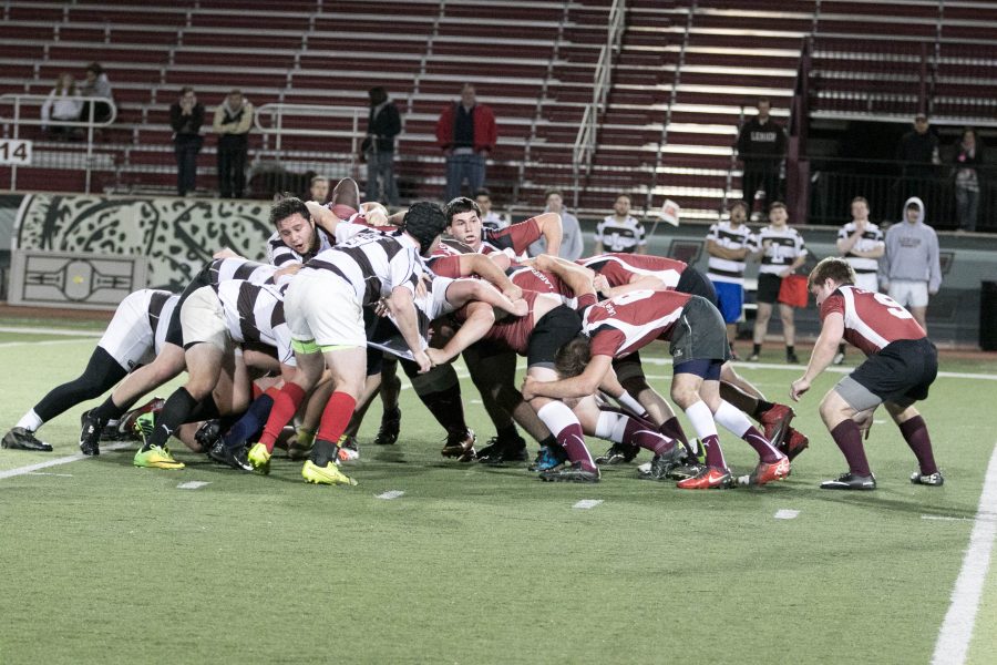 Mens rugby in a scrum. (Photo by Hana Isihara 17).