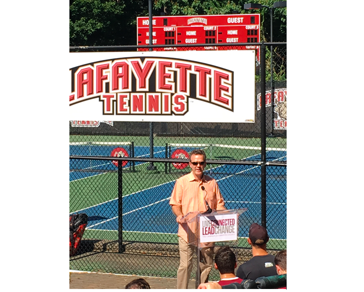 Rob Lyles 86 speaks at the ceremony dedicating the scoreboard to Pete Tomaino. (Photo courtesy of George Robert Lyles III)