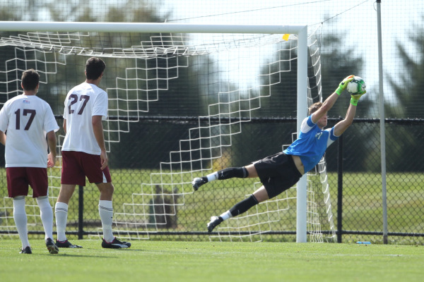 Goalkeeper Brad Seeber diving to make a stop (Photo Courtesy of Athletic Communications)