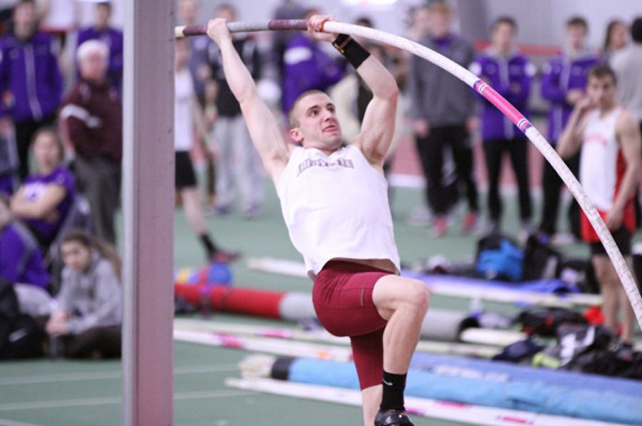 Michael Thorne '18 prepares to pole vault over the high bar. (Photo Courtesy of Athletic Communications)