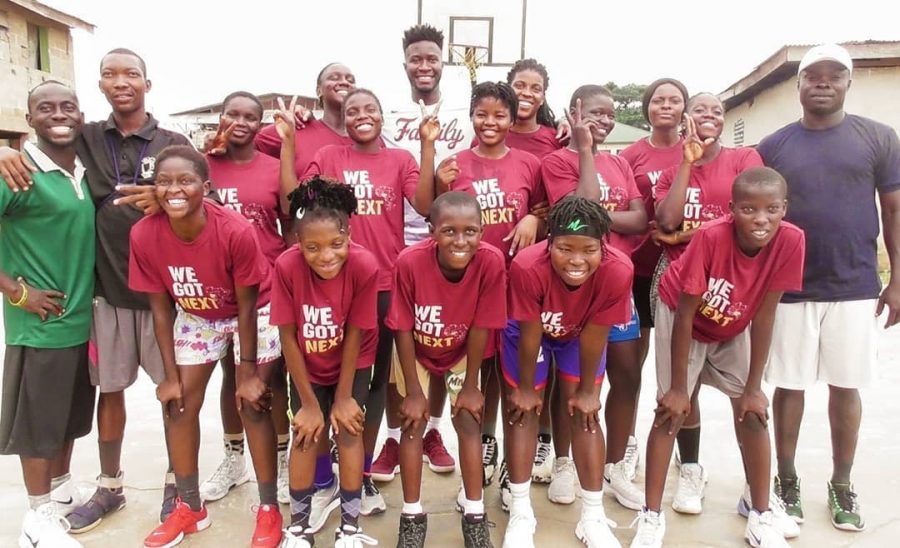 Mike Anekwe 22 (middle) gave out shirts, shoes, basketballs, and refreshments at his foundations camp in Nigeria. (Photo courtesy of Mike Anekwe 22)