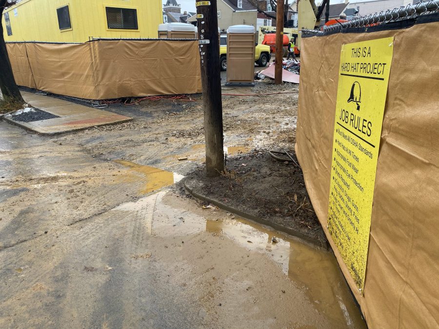 Mud accumulates due to rain on the street outside of an entrance to the McCartney Street Dorm construction site. (Photo courtesy Sharon Engel 22).