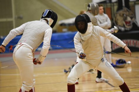 Junior Bora Mutis (right) placed ninth in foil at the MAFCA championship. (Photo courtesy of Athletic Communications)