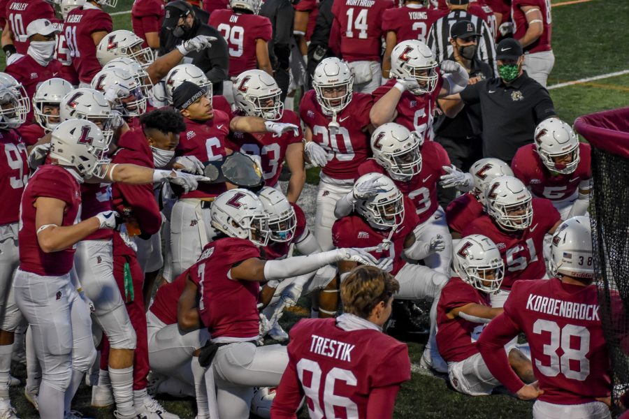 The+football+team+celebrates+their+first+win+over+Colgate+since+2014.+%28Photo+by+Cole+Jacobson+24%29