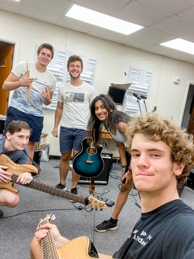 Matt Pinsley, Christian Festa, Ben Putnam, Anouk Sarma and Tommy Henschen pose for a picture during rehearsal for their band.
