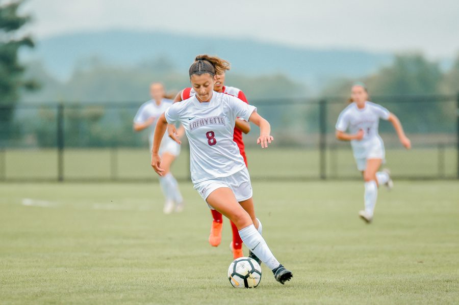 Junior forward Melissa Lamanna scores her fourth goal of the season during Saturdays back-and-forth affair against American. (Photo courtesy of Athletic Communications)
