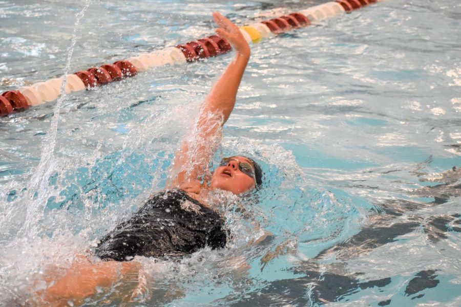 Lafayette swims Maggie Ivie competing in backstroke, placing fifth overall in the event this past Saturday at the Navy Quad meet. (Photo courtesy of Shannon Dyke 22)