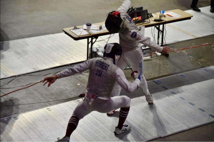 Freshman Beninto Hergert (pictured) competing in foil, finishing in 28th place at the Penn State Open this past weekend. (Photo courtesy of Amir Whitehead 24)