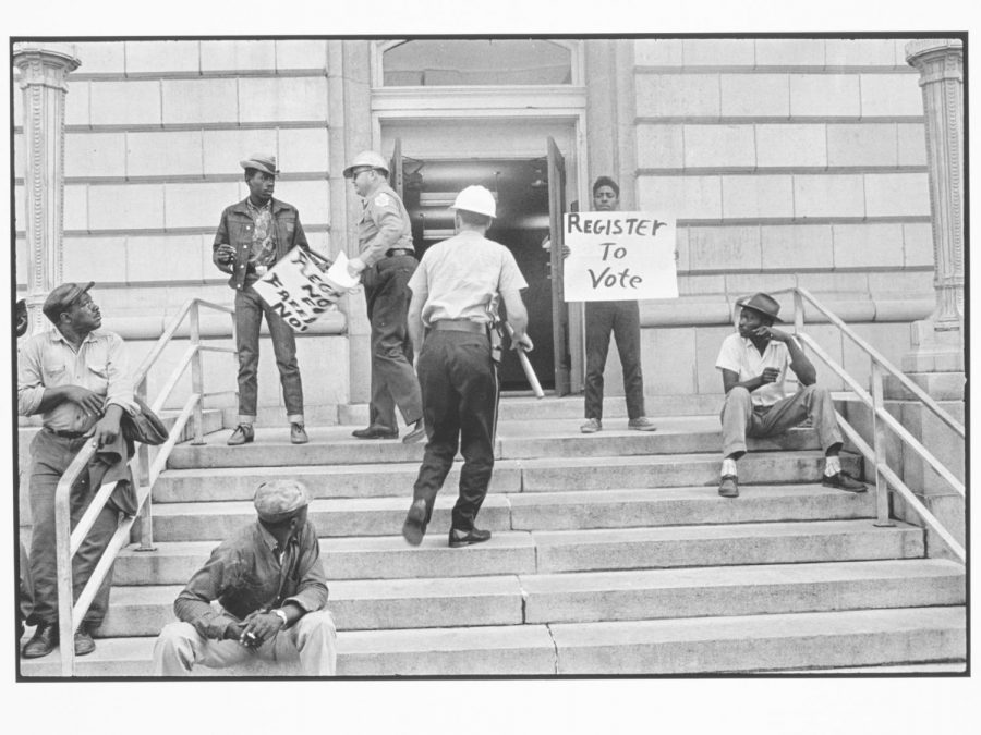 The gift contains photos such as this one, taken by Danny Lyon, which features Sheriff Jim Clark arresting two SNCC voter registration workers on the steps of a federal building in Selma, Alabama in 1963. (Photo courtesy of Lafayette College Art Galleries)