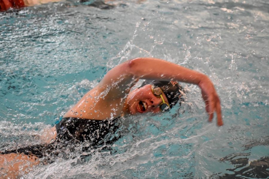 Freshman Megan Douchette (pictured) competes in the freestyle at two-day meet against East Stroudsburg this past weekend. (Photo courtesy of Shannon Dyke 22)