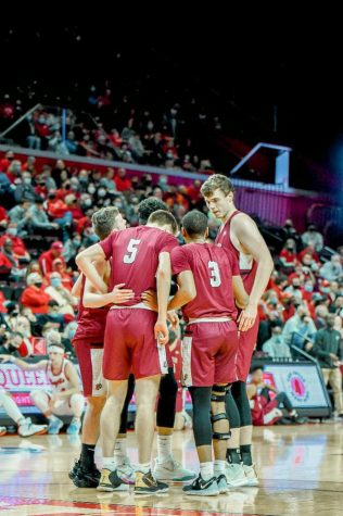 The basketball team talking strategy during their Monday night win over Columbia University. (Photo courtesy of GoLeopards.com)