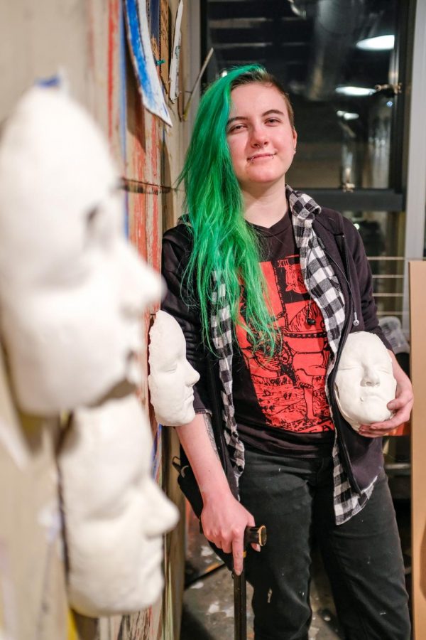 Through their art, Sadie Graeff 22 asks viewers to question what makes a person who they are. (Photo by Caroline Burns 22)