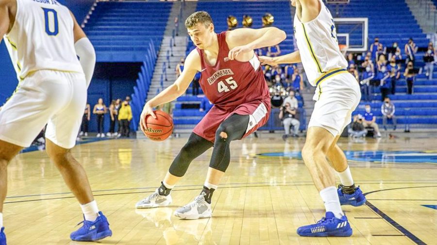 Junior Neal Quinn (pictured) drives through the lane for an easy two in his game-making performance in the win against American. (Photo courtesy of GoLeopards)