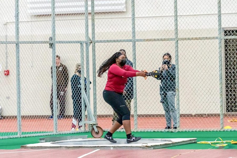Junior Solape Fakorede (pictured) participating in the weighted throw competition as the women finish in second and the men finish in 5th at the Moravian Invite last weekend. (Photo courtesy of GoLeopards)