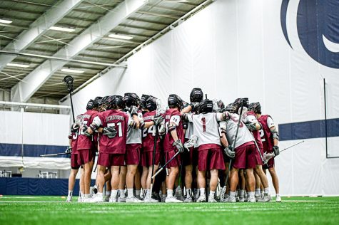 The mens lacrosse team joins into a huddle after last weeks Penn State game. (Photo courtesy of GoLeopards)