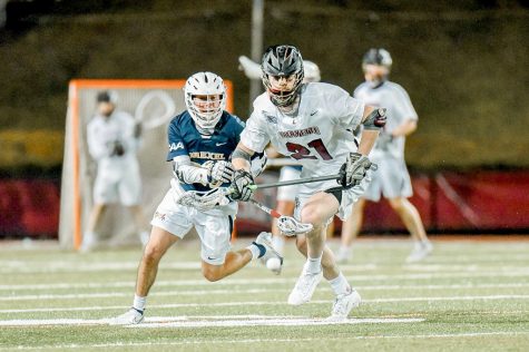 Junior midfielder Brian Collins (pictured) battles with a defender in last Tuesdays 13-11 win against Drexel University. (Photo courtesy of GoLeopards)