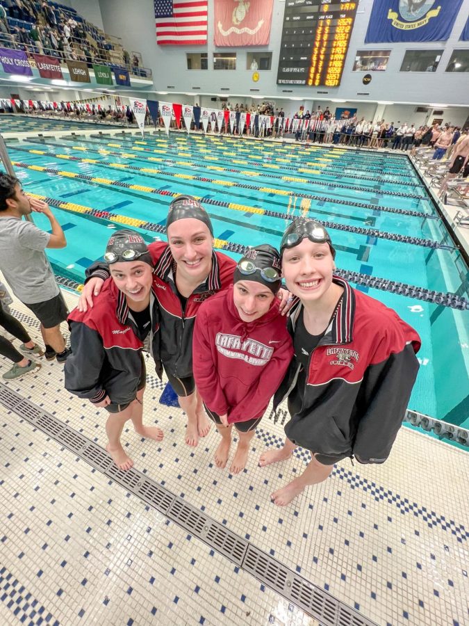The 200-yard freestyle relay with freshman Maggie Ivie, senior Sam Talecki, sophomore Kristin O'Connor and senior Emily Wilson (pictured left to right) set a school record at the Patriot League Championships. (Photo courtesy of Emily Richter '22)
