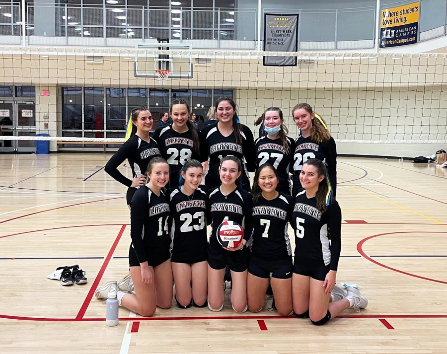 The club volleyball team wore ribbons in support of Ukraine during Saturdays tournament, where they placed second out of six teams. (Photo courtesy of Nina Curko 22)