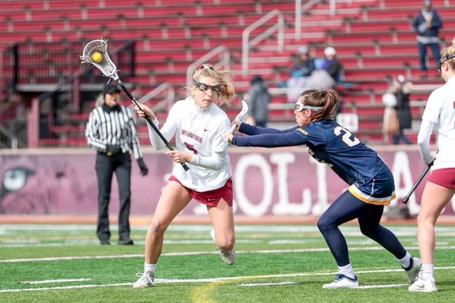 Sophomore Abby Romano (pictured) works around a defender in women's lacrosse's win over Drexel. (Photo courtesy of GoLeopards)