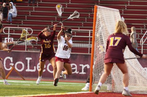 Senior attacker Olivia Cunningham drives past an Iona College defender with her eyes on scoring. (Photo courtesy of GoLeopards)