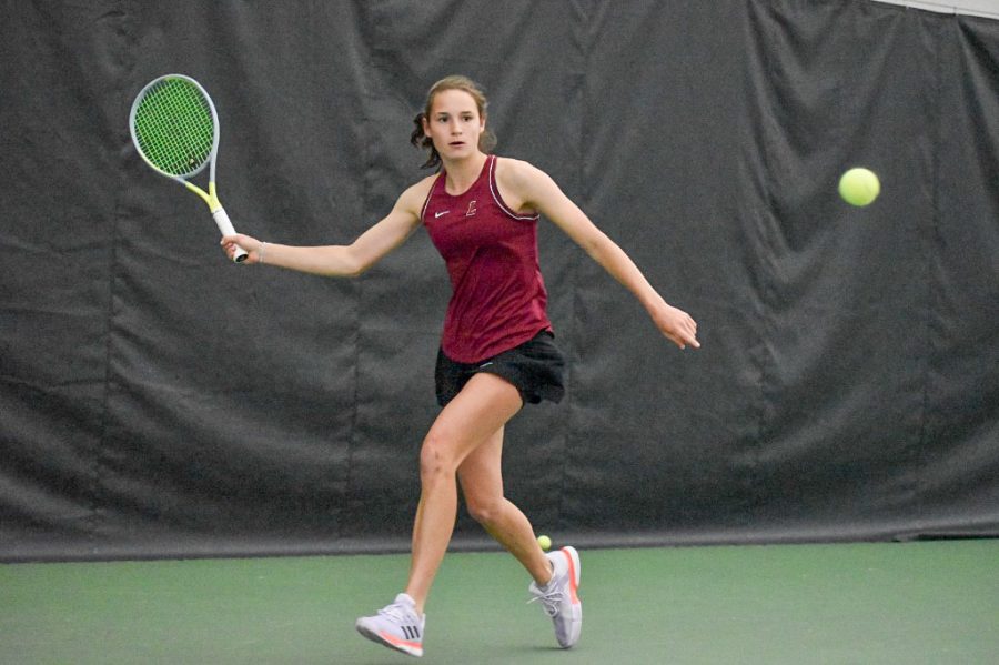 Freshman Olivia Boeckman fires the ball over the net as part of her doubles victory against Holy Cross. (Photo courtesy of GoLeopards)