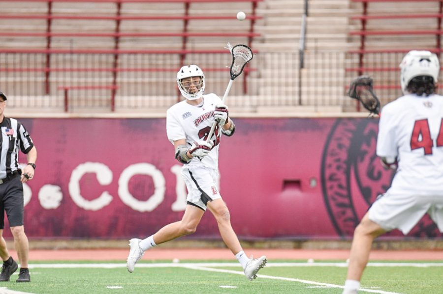 Sophomore attacker Charlie Cunniffe passes the ball in part of his six goal, eight point performance against Bucknell. (Photo courtesy of GoLeopards)