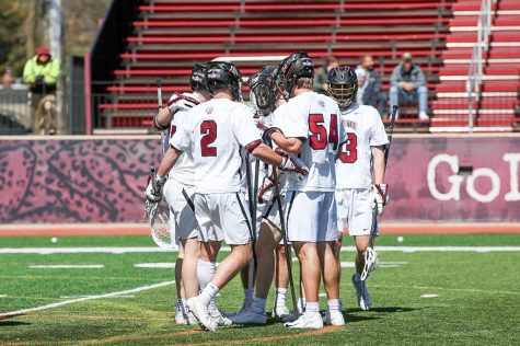 Lafayette huddles in the middle of the game against Holy Cross as they cruised to a 21-11 win for their Patriot League victory in almost 2,000 days. (Photo courtesy of GoLeopards)