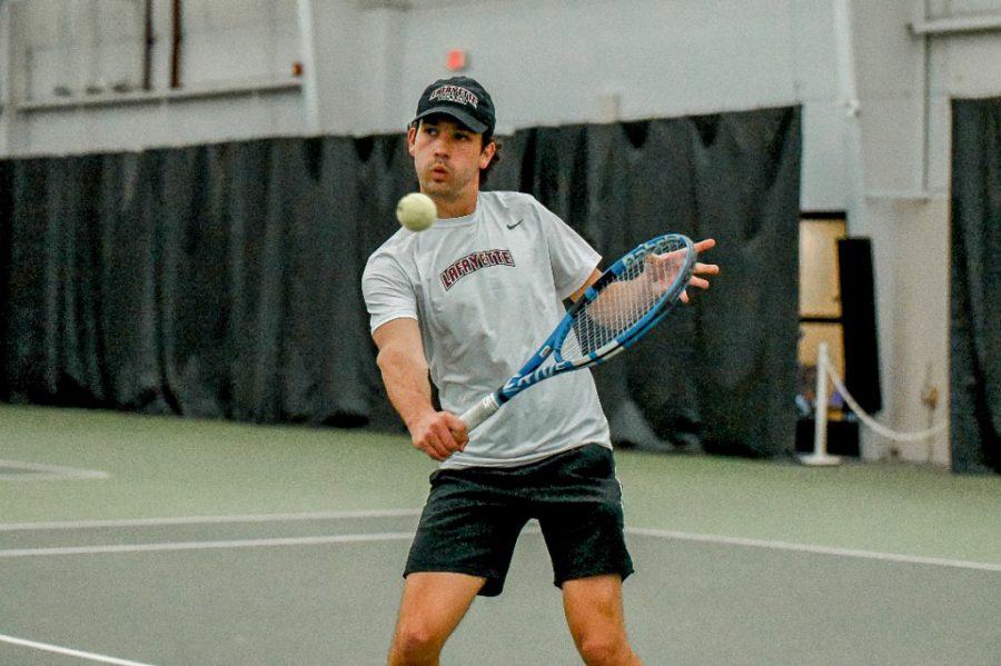 Sophomore+Davus+Esslinger+fires+a+backhand+during+his+singles+match+against+Holy+Cross+last+week.+%0A%28Photo+courtesy+of+GoLeopards%29