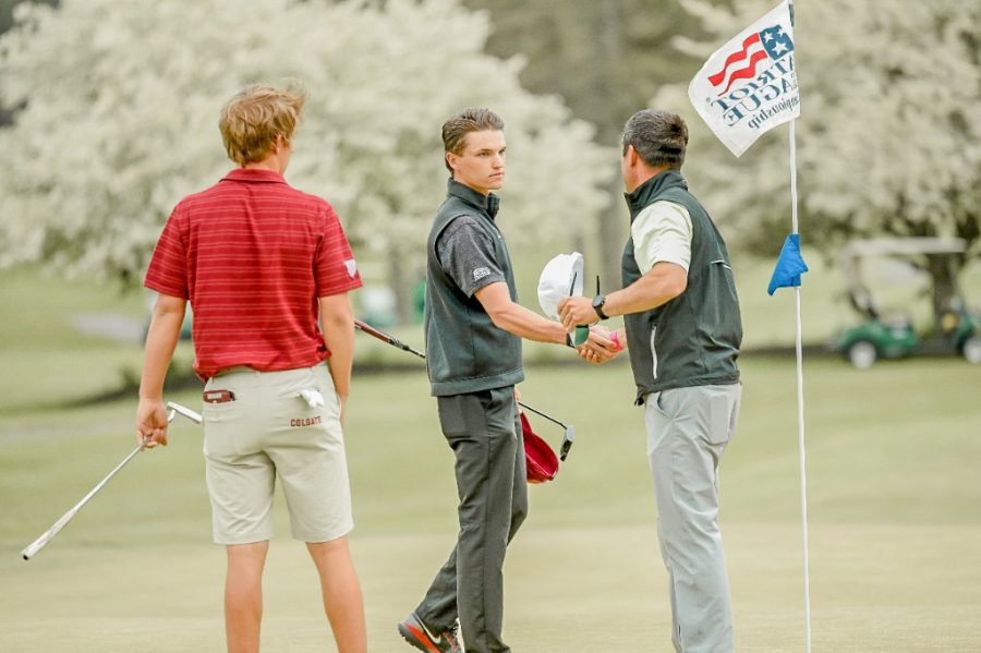 Senior Ryan Tall shakes hands with the competition following his 30-foot putt to win the Patriot League Individual Championship. 
(Photo Courtesy of GoLeopards)