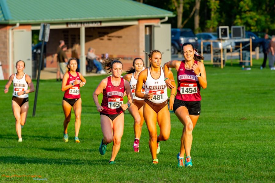 Seniors Becky Hartman and Rachel Hurley lead the pack during the Lafayette-Lehigh dual meet womens race on Friday Sept. 16. Hartman went on to win the race.