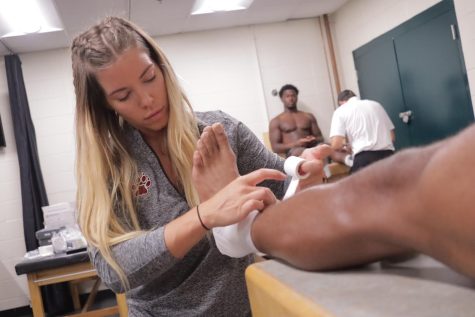 As a primary contact athletic trainer, Amber Kinney works with student-athletes on both their physical and mental well-being. (Photo courtesy of 
Philip LaBella)