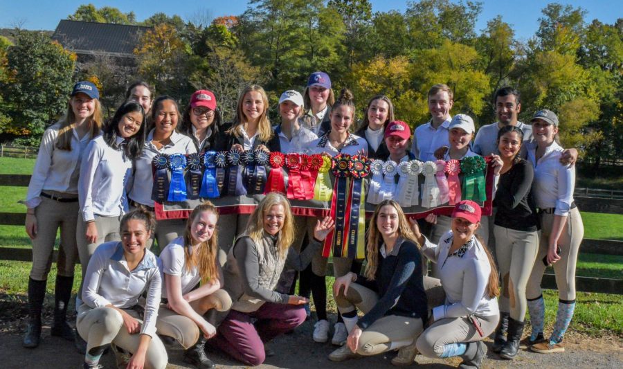 The+equestrian+team+shows+off+a+plethora+of+ribbons+after+their+weekend+double-header.+%28Photo+courtesy+of+Emma+Sylvester+25%29