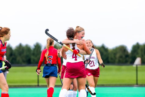Senior defender Sydney Woolston is embraced by her team after scoring her third career goal during the Leopards victory against Richmond. 
(Photo by Doug Kilpatrick for GoLeopards)