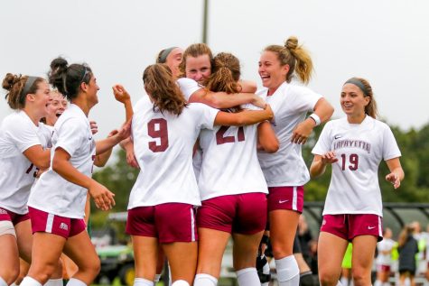 The womens soccer team embraces following their first fall 2022 Patriot League win against Loyola. 
(Photo by Rick Smith for GoLeopards)
