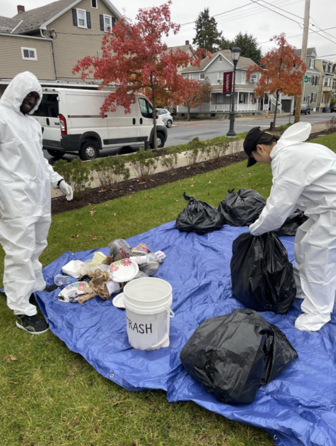 Eco Rep volunteers put on hazmat suits to weigh and sort waste products from the McCartneys. (Photo courtesy of the Office of Sustainability)